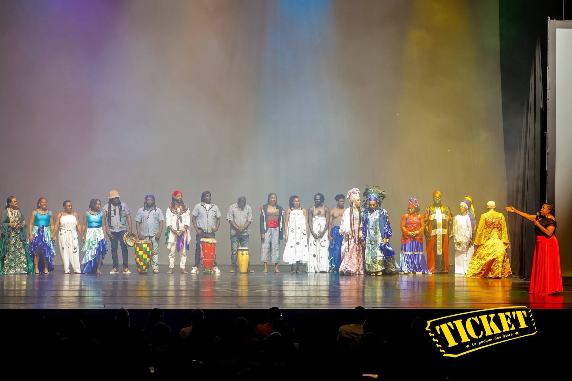 The full company lined up across the stage at curtain call